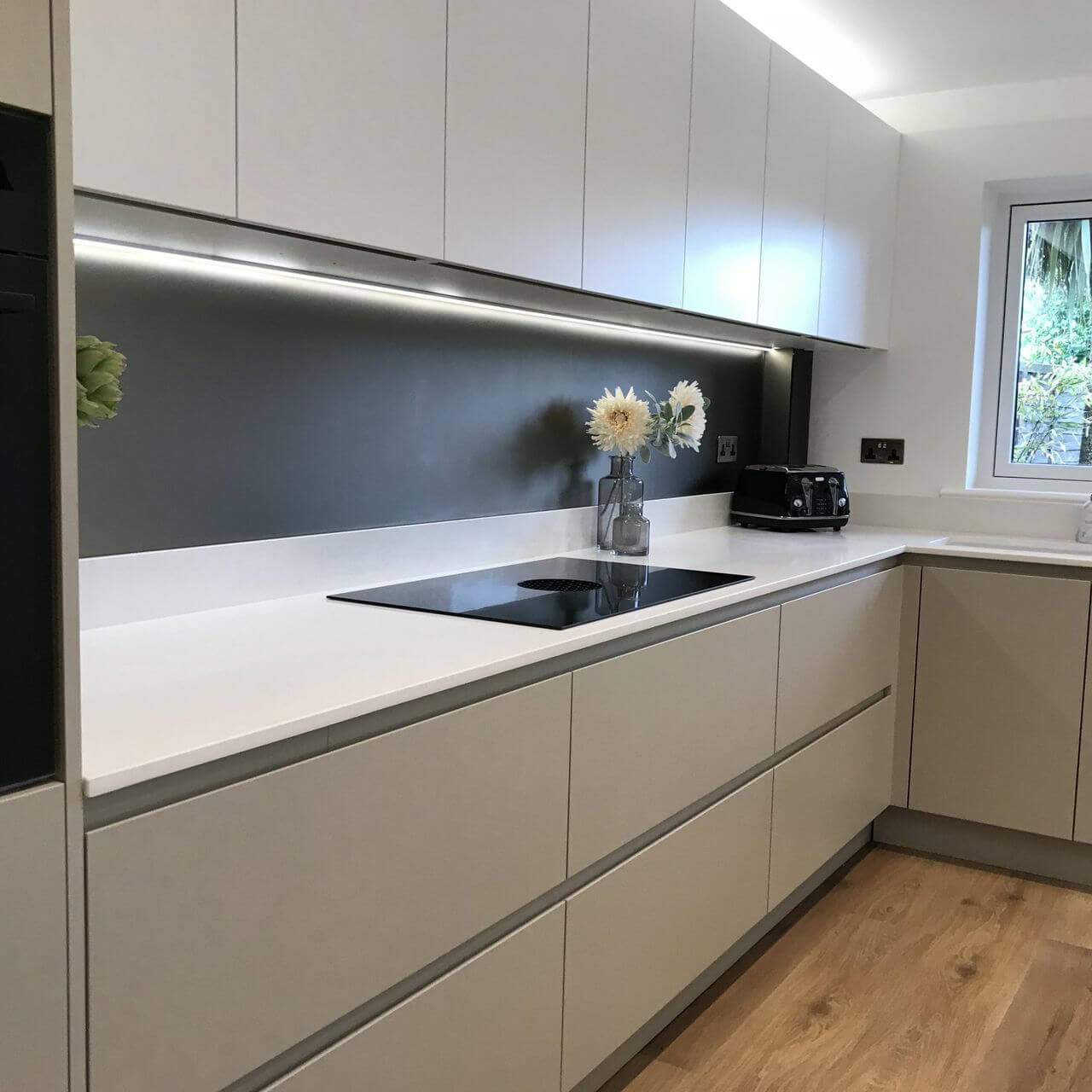 A Subtly Lit Kitchen Island In An Open Plan Home | Artizan Interiors